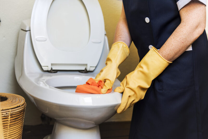 housekeeper-cleaning-hotel-room